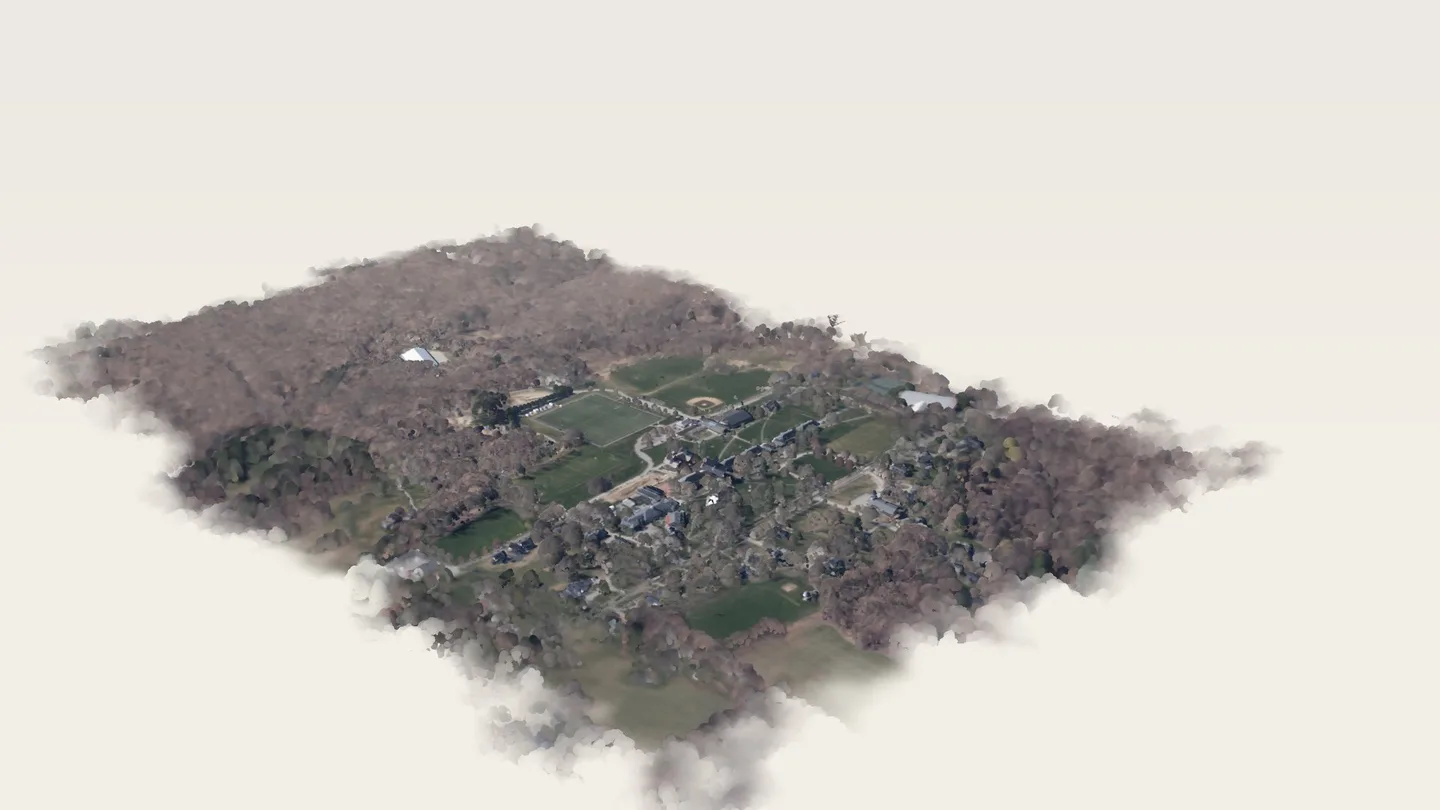 The Pomfret School campus and the woods around it, seen from the air to the south-east: a render of the real 2023 LiDAR survey, coloured from the spring 2023 aerial photograph. Fields, roofs and bare April trees; the edges of the surveyed area fade into the page.
