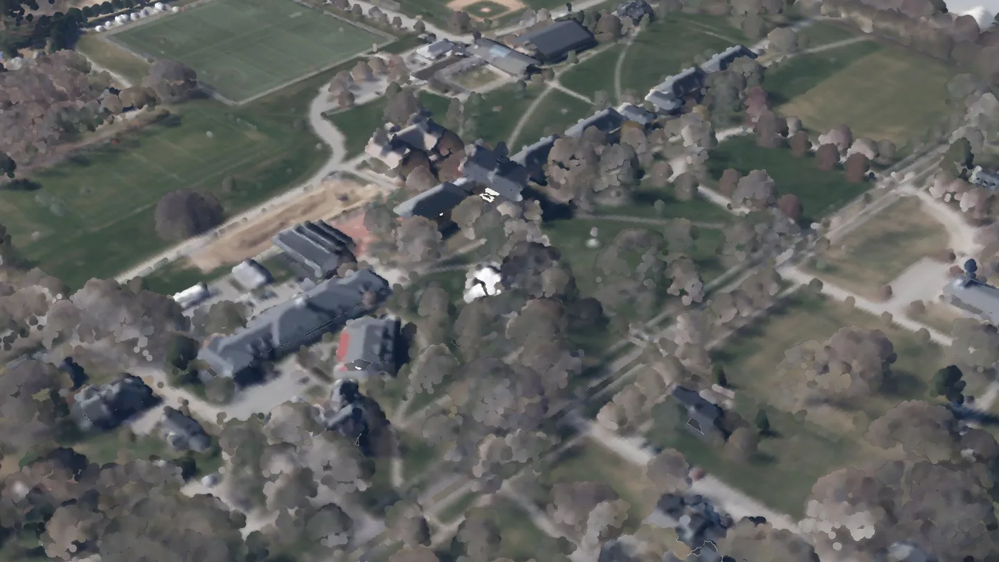 Clark Memorial Chapel among its neighbours, seen from the air to the south-east: a render of the real 2023 LiDAR survey, coloured from the spring 2023 aerial photograph. A crimson ring marks its roof.