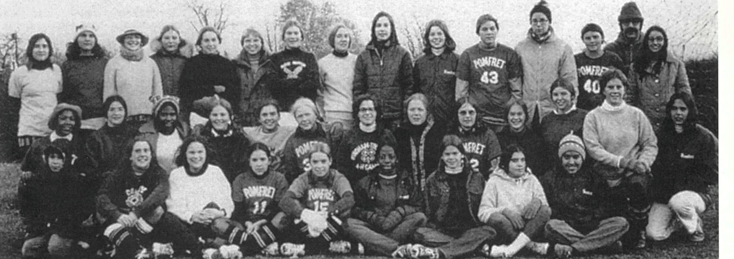 Nineteen-seventies girls' soccer team posed together outdoors with coach Hagop Merjian, from a magazine page captioned "Merjian's Maulers."